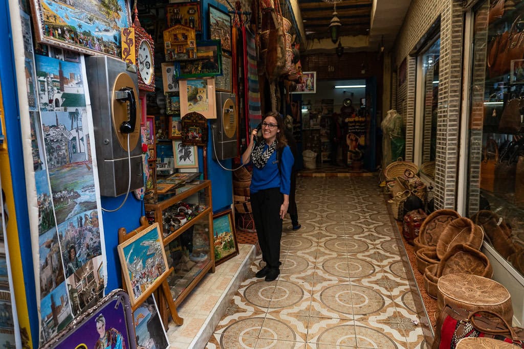 pretending to make a call in medina of tangier on day trip to Morocco tour