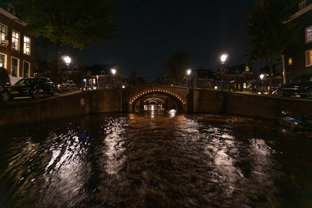 amsterdam canals lit up at night during our Blue Boat Amsterdam Evening Cruise