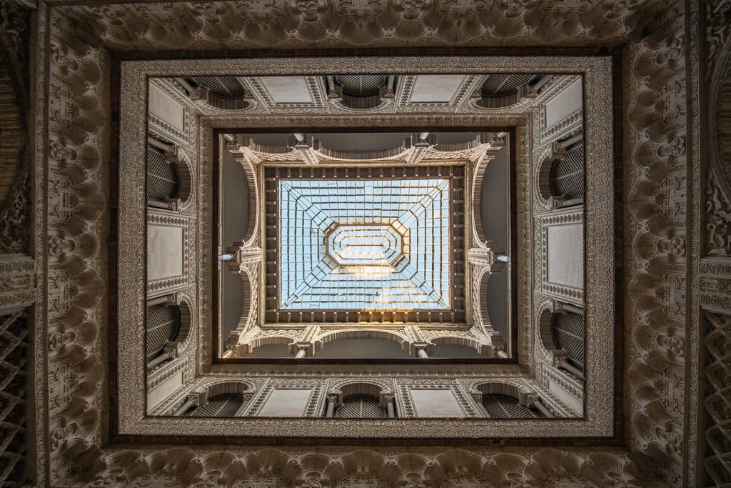 ornate ceiling and upper levels in the real alcazar in sevilla spain