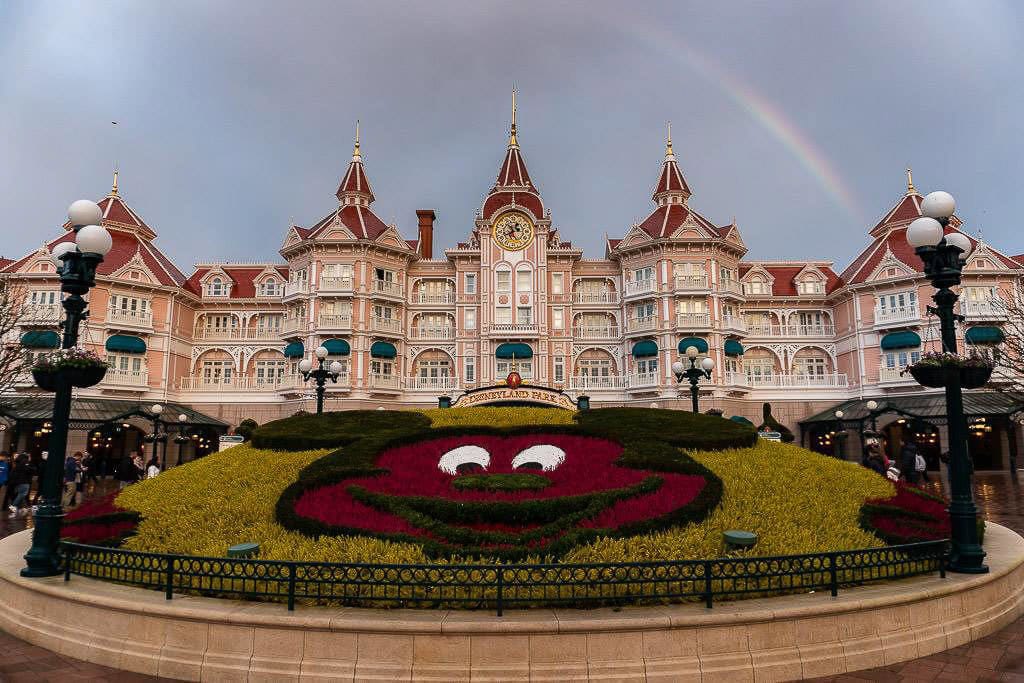 entry to Disneyland Paris near france with rainbow overhead