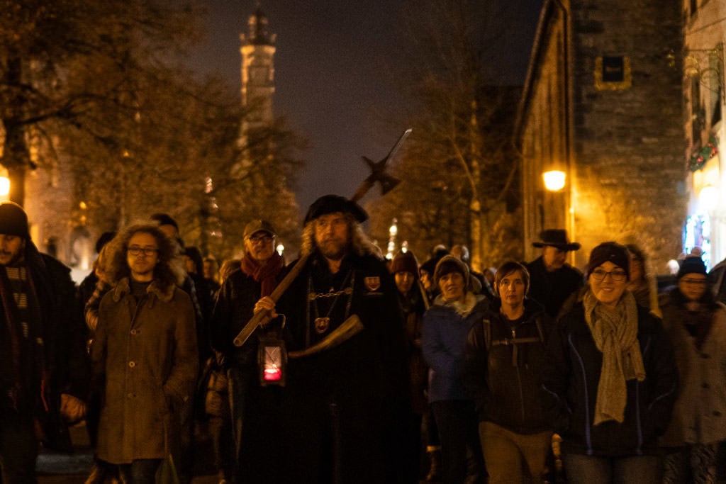 walking with group during night watchman tour - things to do in rothenburg germany