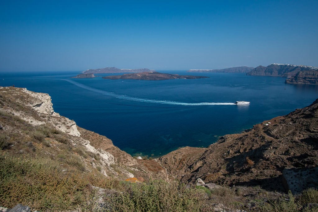 ship in water near heart of santorini megalochori