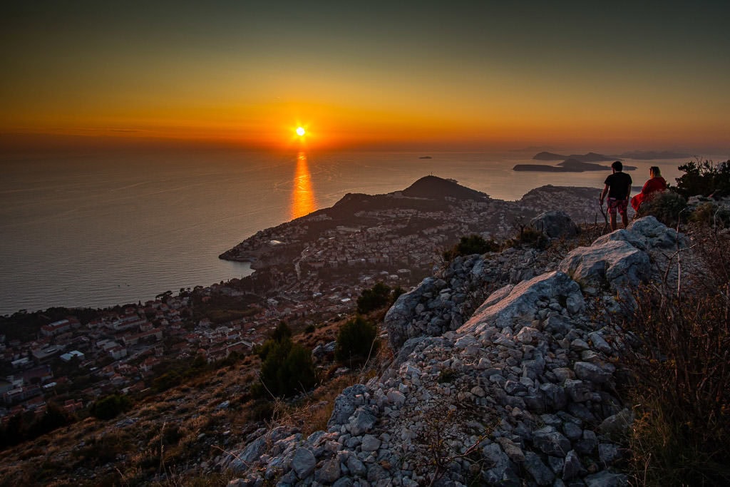 people watching the sunset over Dubrovnik on Mount Srd