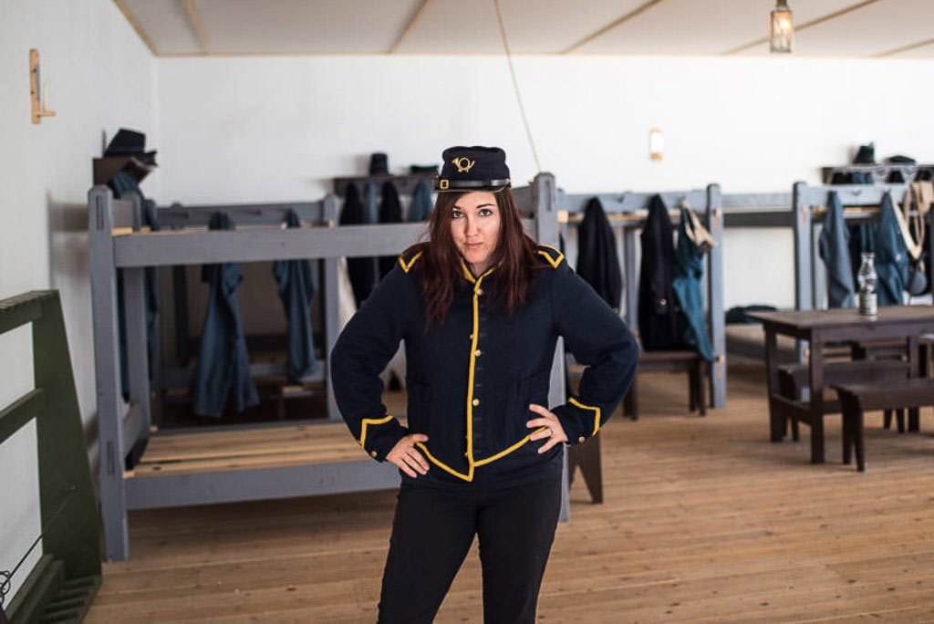 Brooke posing with an outfit she tried on while visiting Fort Stanton Historic Site