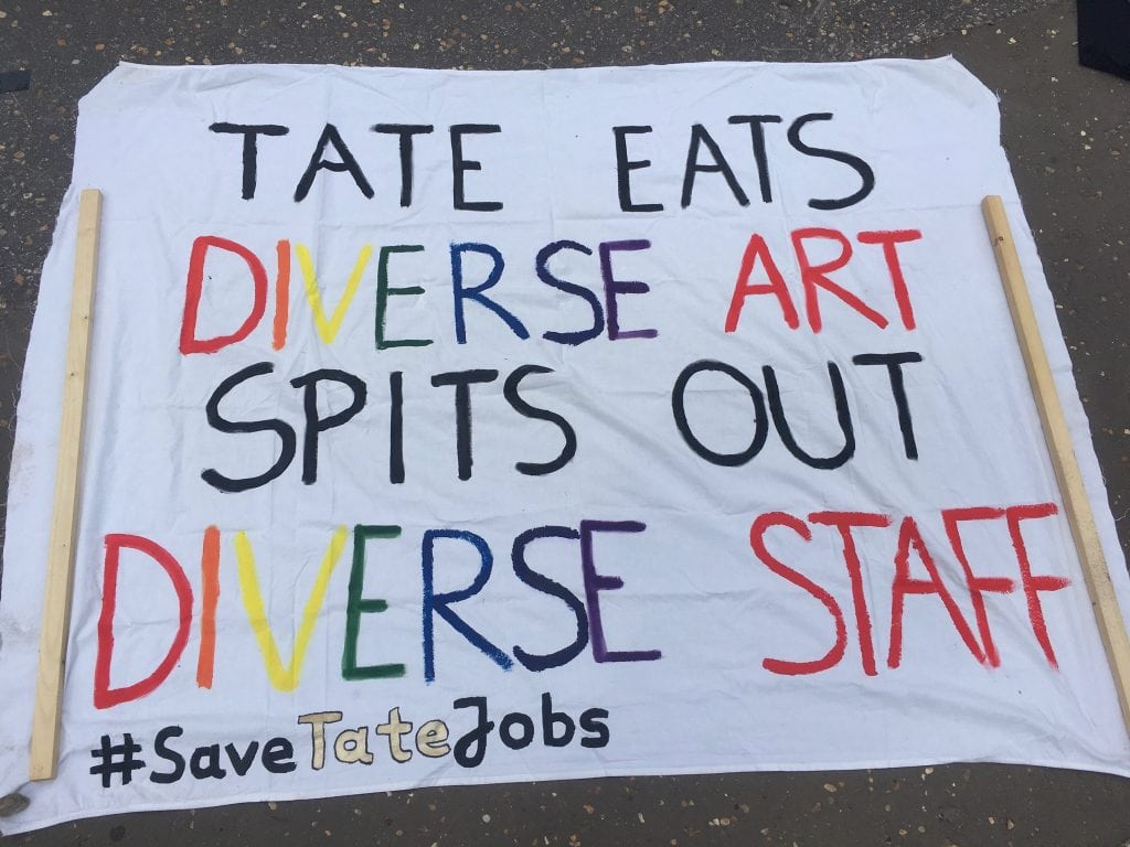 A banner from the Tate Enterprises strikes in August 2020