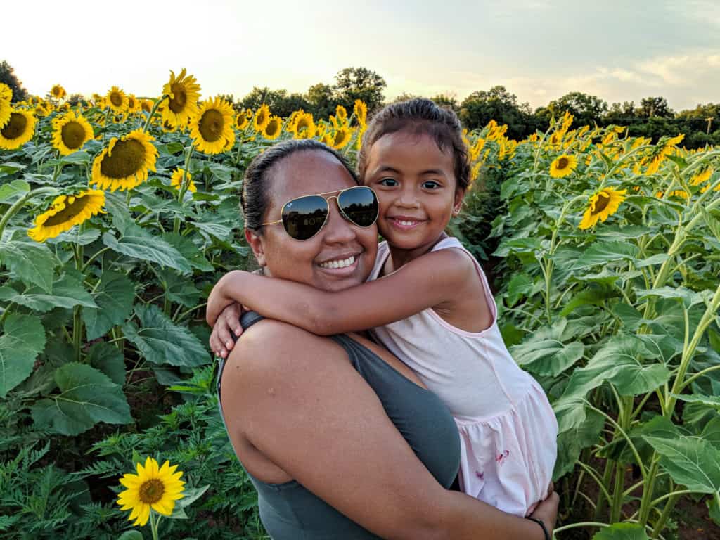 mother and daughter enjoying the sunflowers of McKee-Beshers during peak bloom