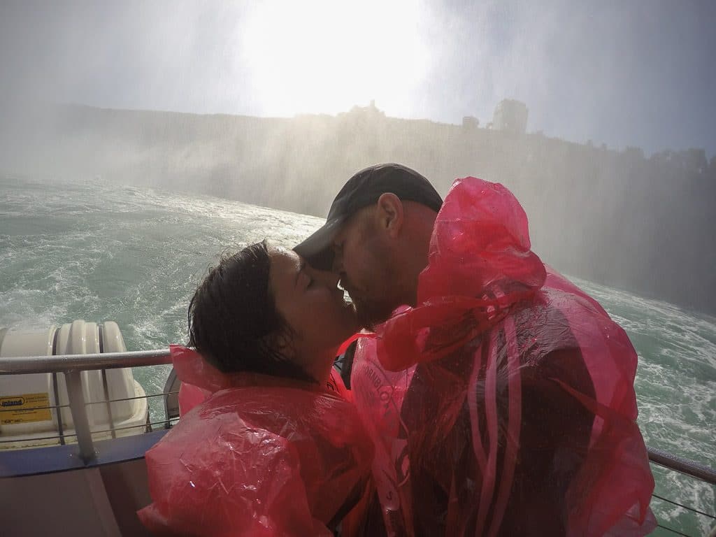 Brooke and Buddy doing the obligatory kiss in front of Niagara Falls during their Hornblower Niagara Cruise