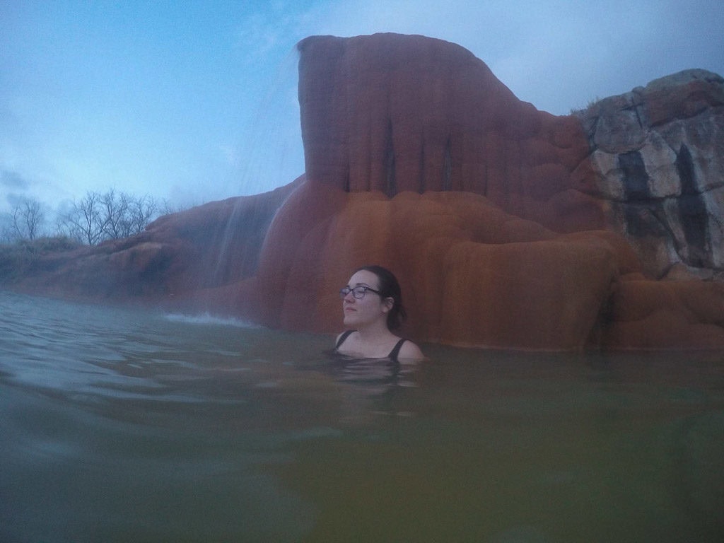 Brooke soaking in one of the large Hot Spring Pools at Mystic Hot Springs in Utah