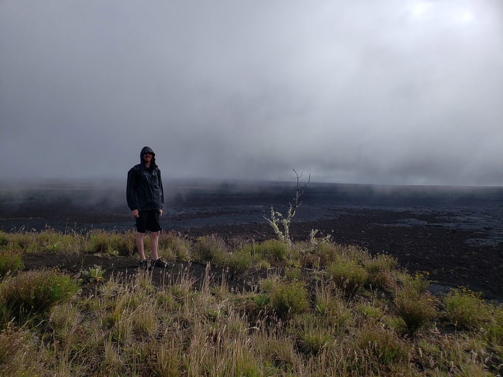 buddy with view from Pu'u Huluhulu Cinder Cone Hike near mauna kea on the big island