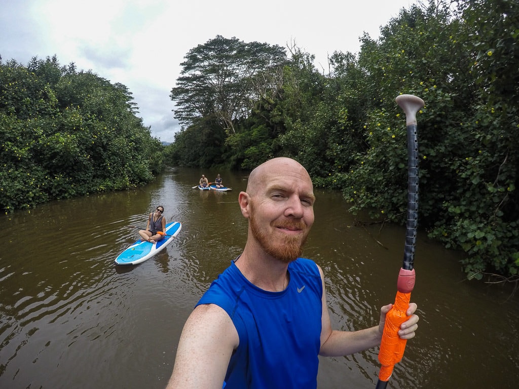 paddleboarding with friends on the Hanalei River - one of our favorite things to do in kauai