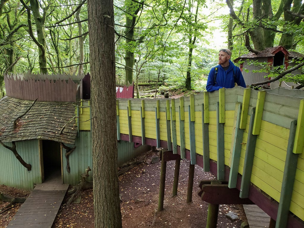 Buddy on one of the bridges connecting some of the amazing little tree house buildings