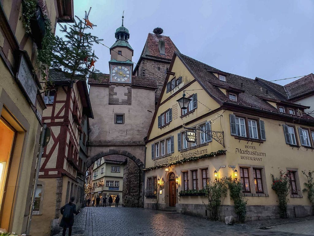 medieval clock tower and buildings in rothenburg in germany