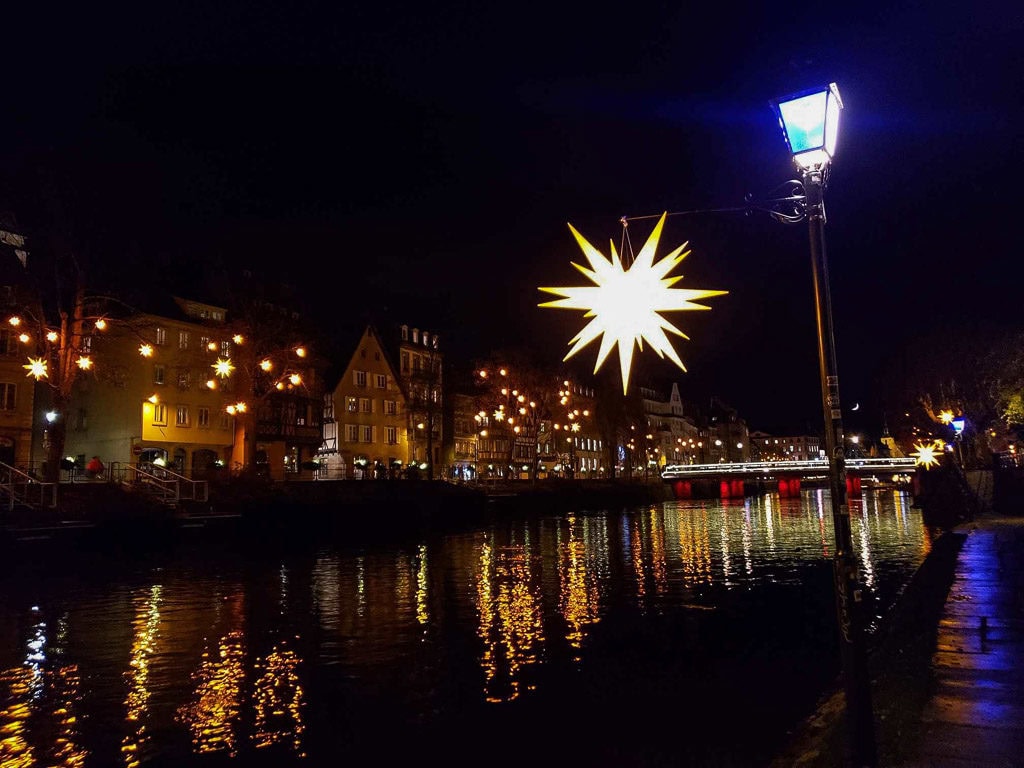 strasbourg france christmas lights reflecting on the river