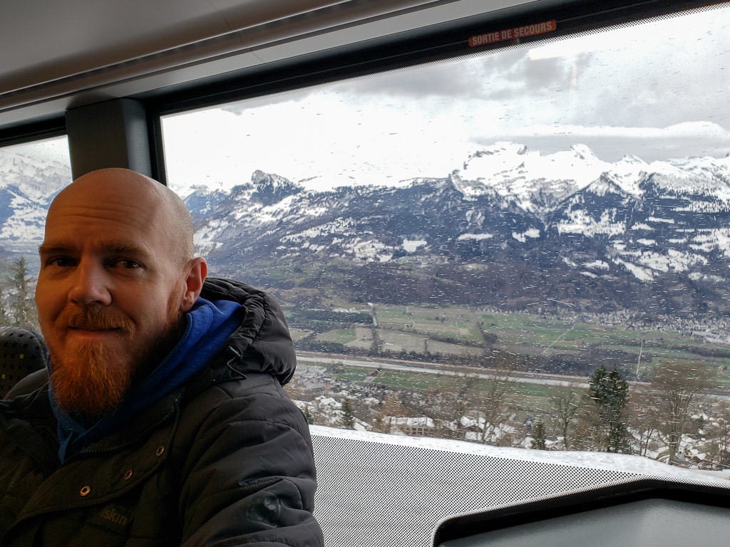 taking a bus with mountain views during a between-sit winter Stop in Liechtenstein