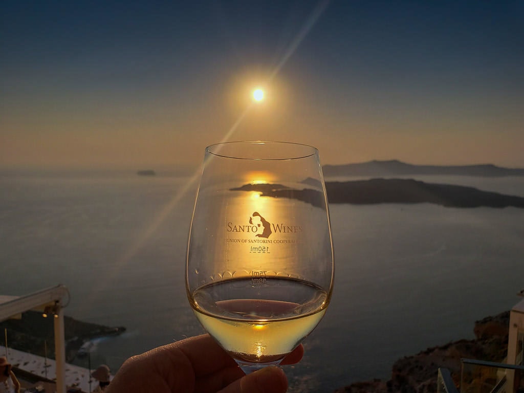 santo winery santorini sunset with wine