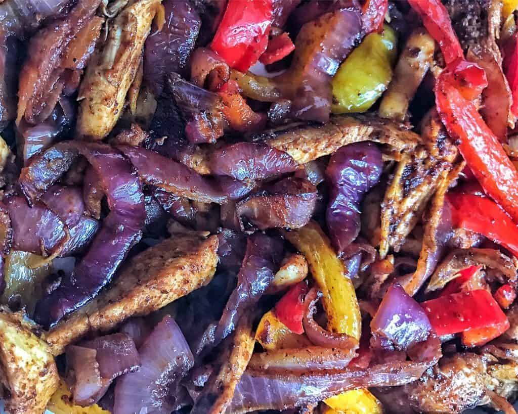 Onion, chicken, and bell pepper fajitas