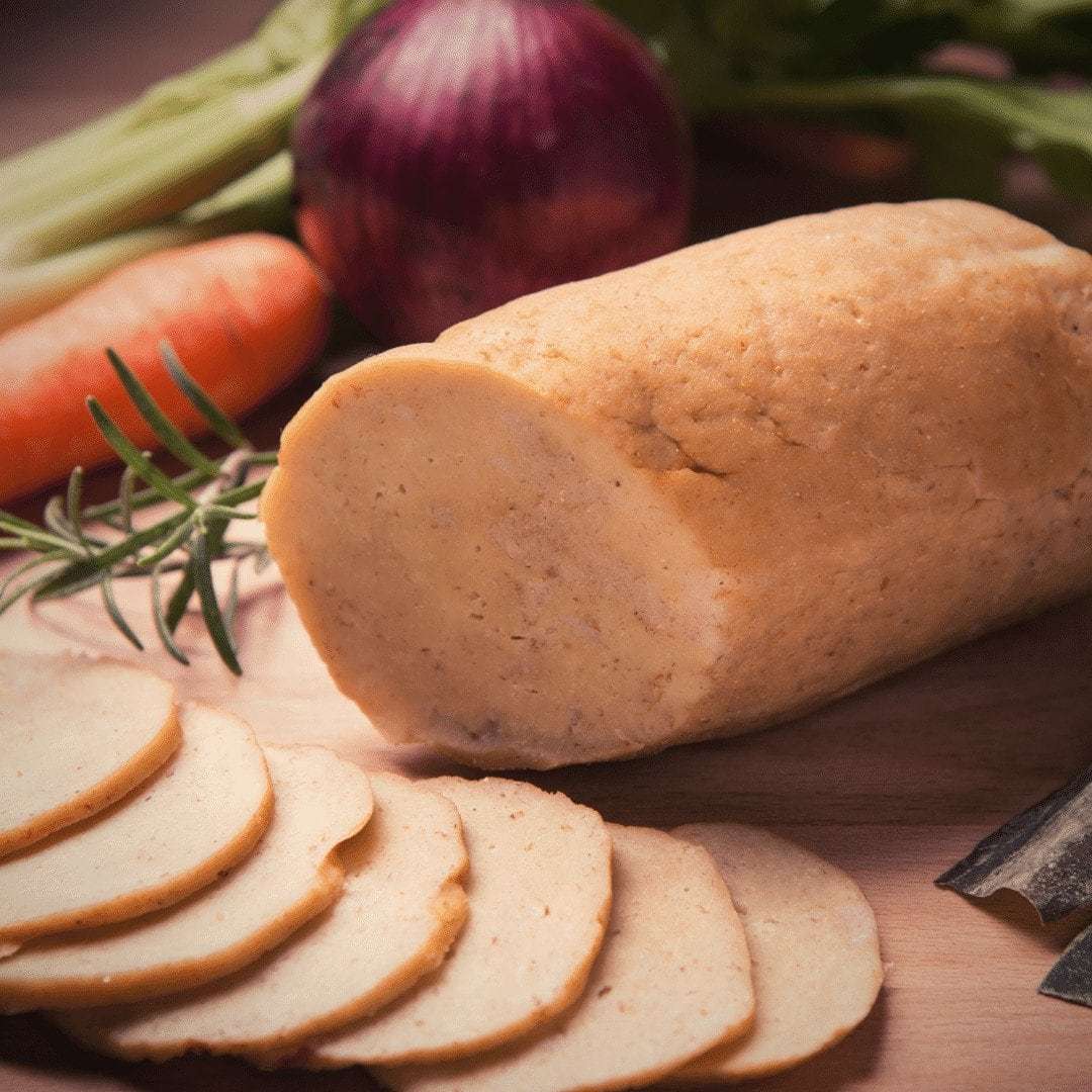 Seitan can be purchased as a loaf, and then seasoned and added to any meal you like