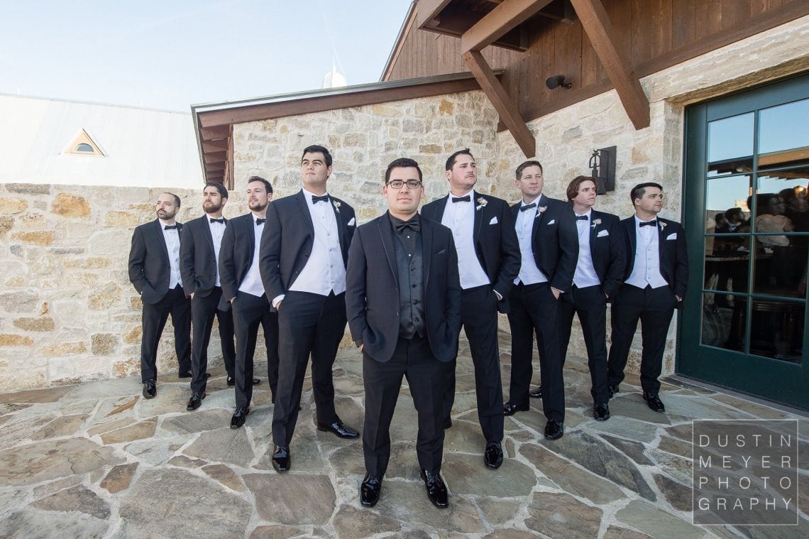 The groomsmen proudly standing by the groom