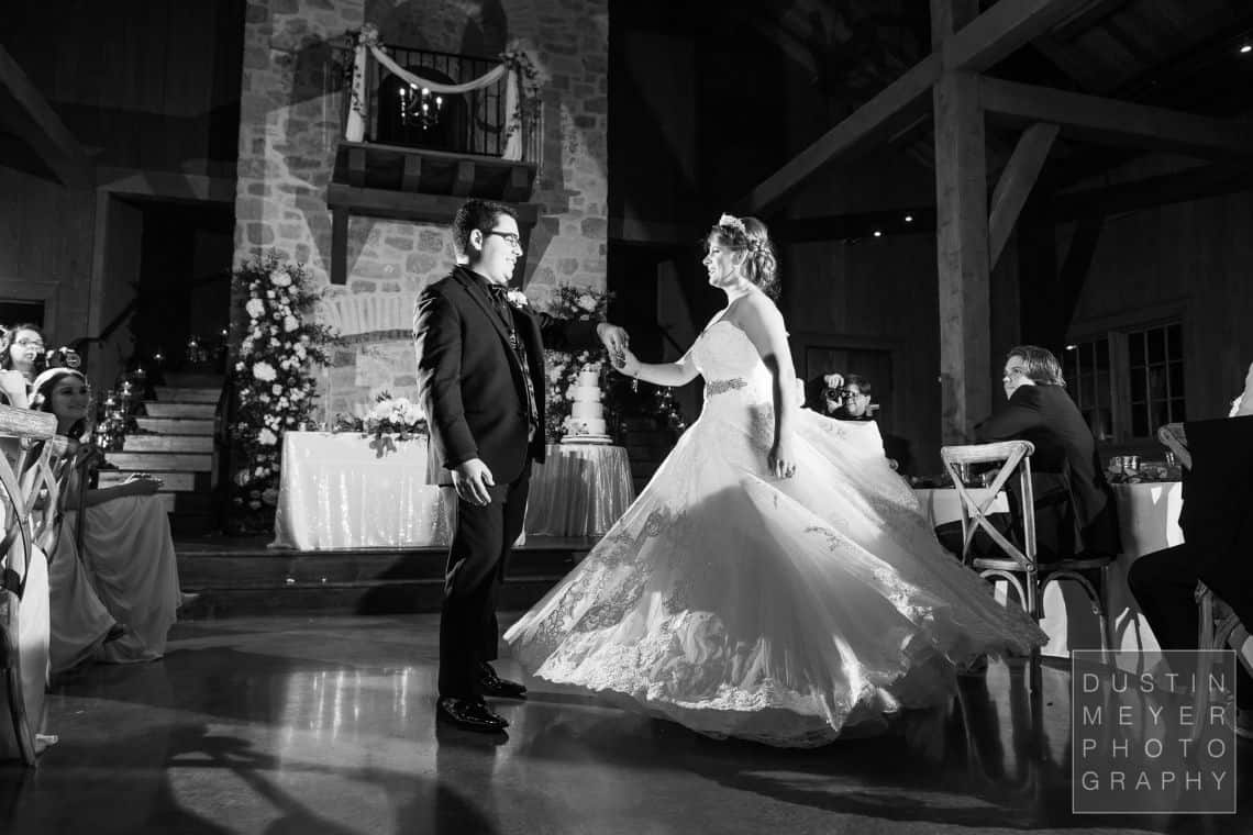 Black and white photo of the first dance of the bride and groom.