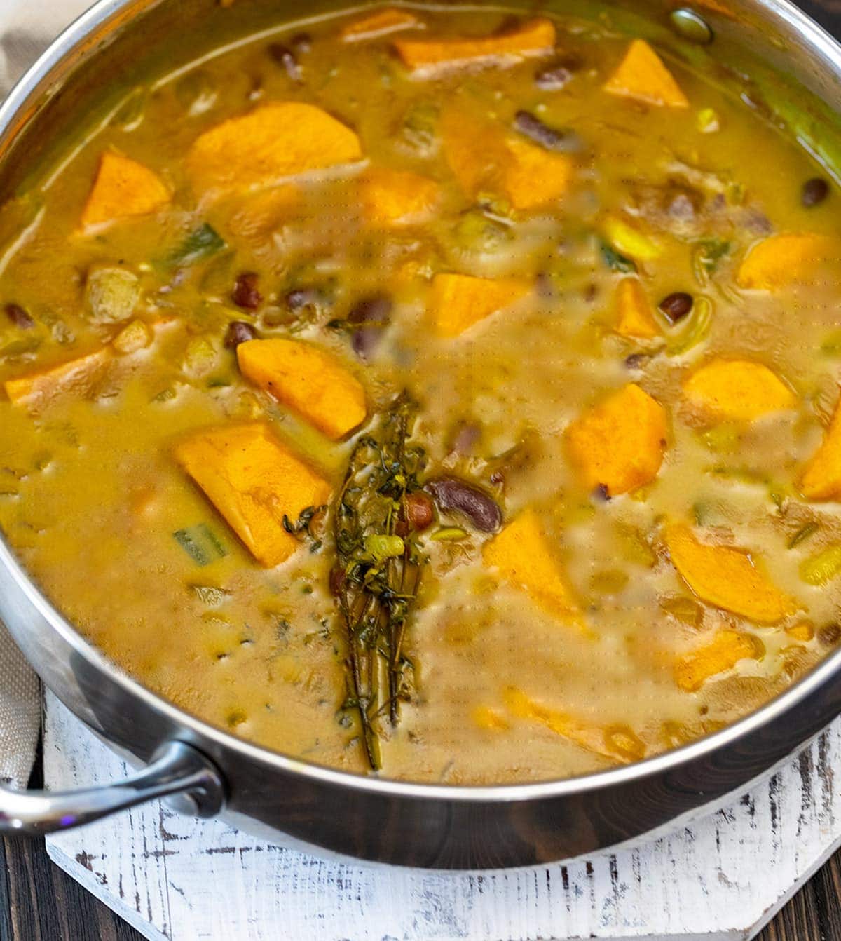 sweet potato kidney bean curry overlay in saucepan