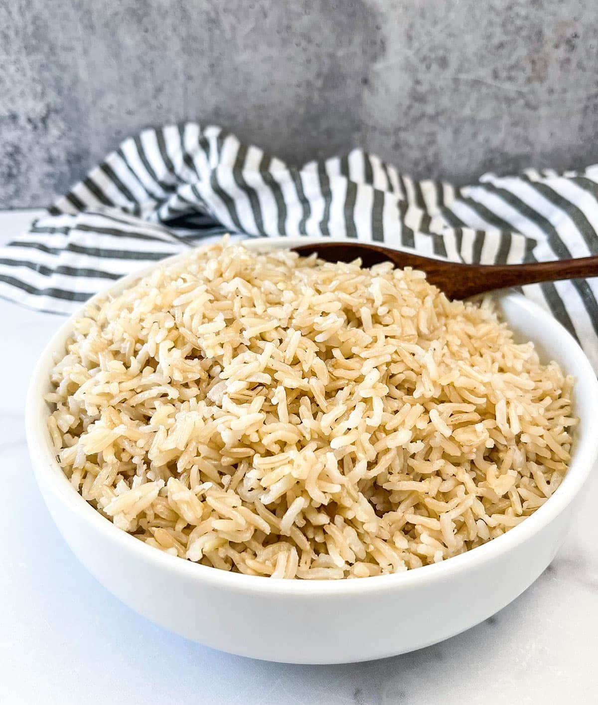 basmati rice instant pot version in a white bowl on a white background