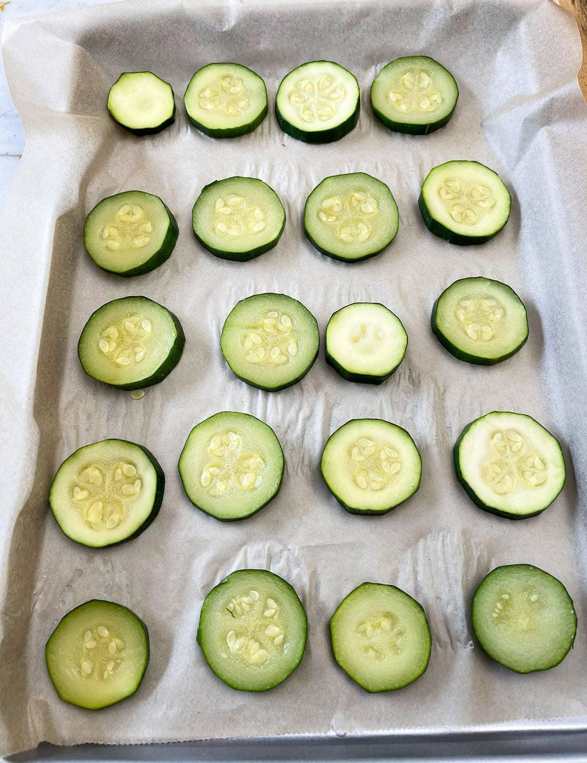 zucchini slices on a baking sheet