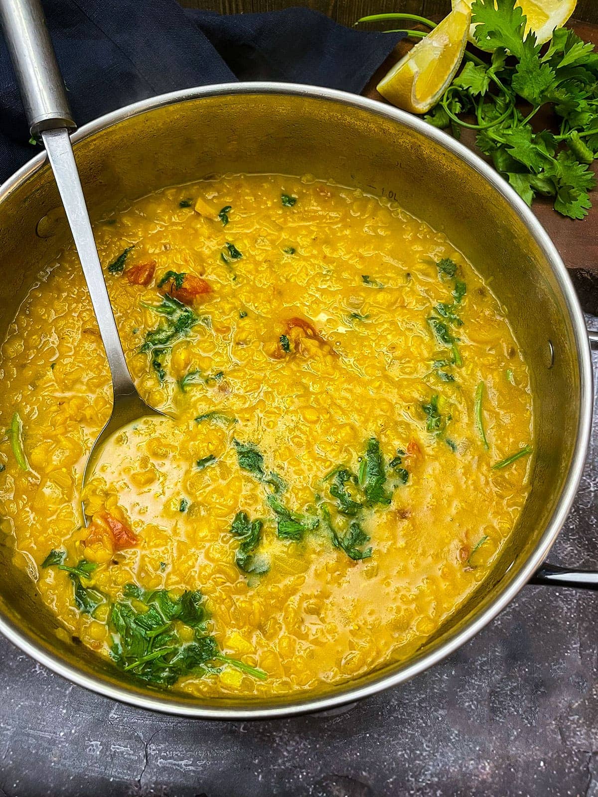 masoor dal cooking in a silver saucepan