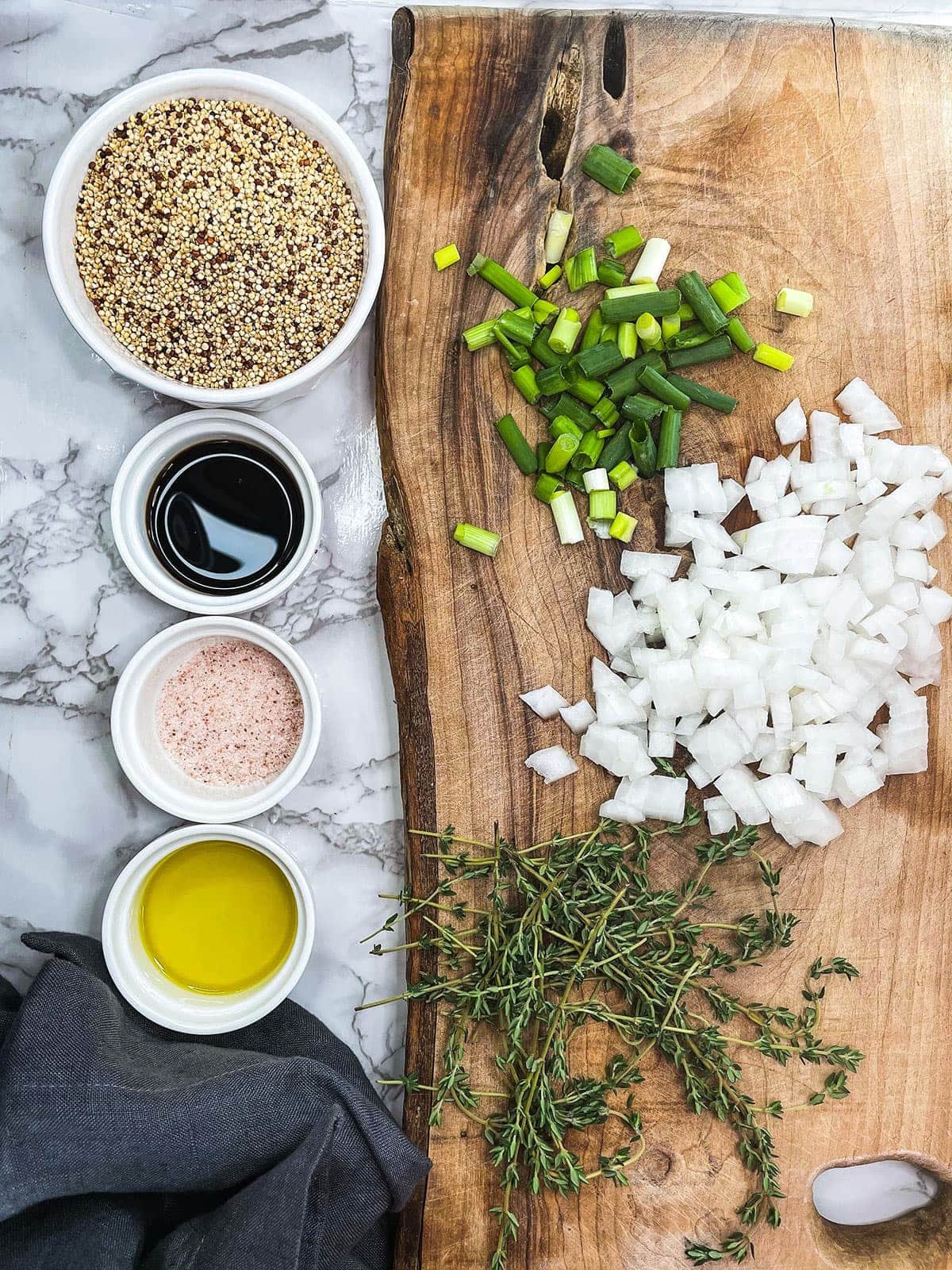 quinoa ingredients on a white background and wooden cutting board