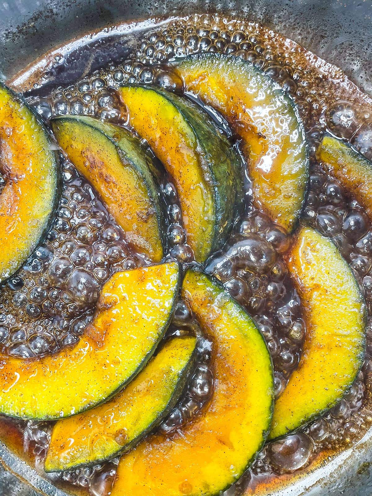 cooking candied pumpkin in saucepan