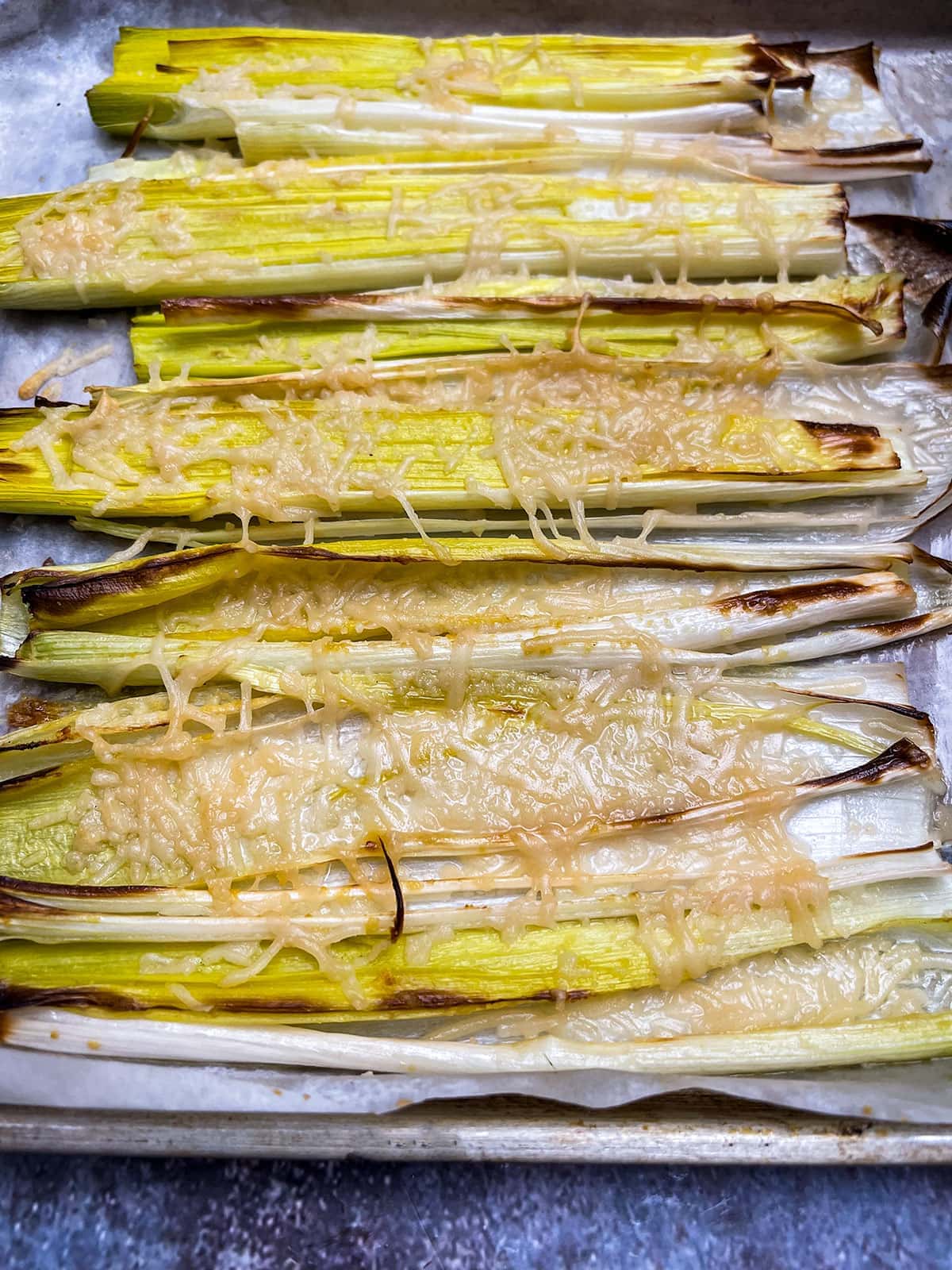 roasted leeks in baking sheet, close view