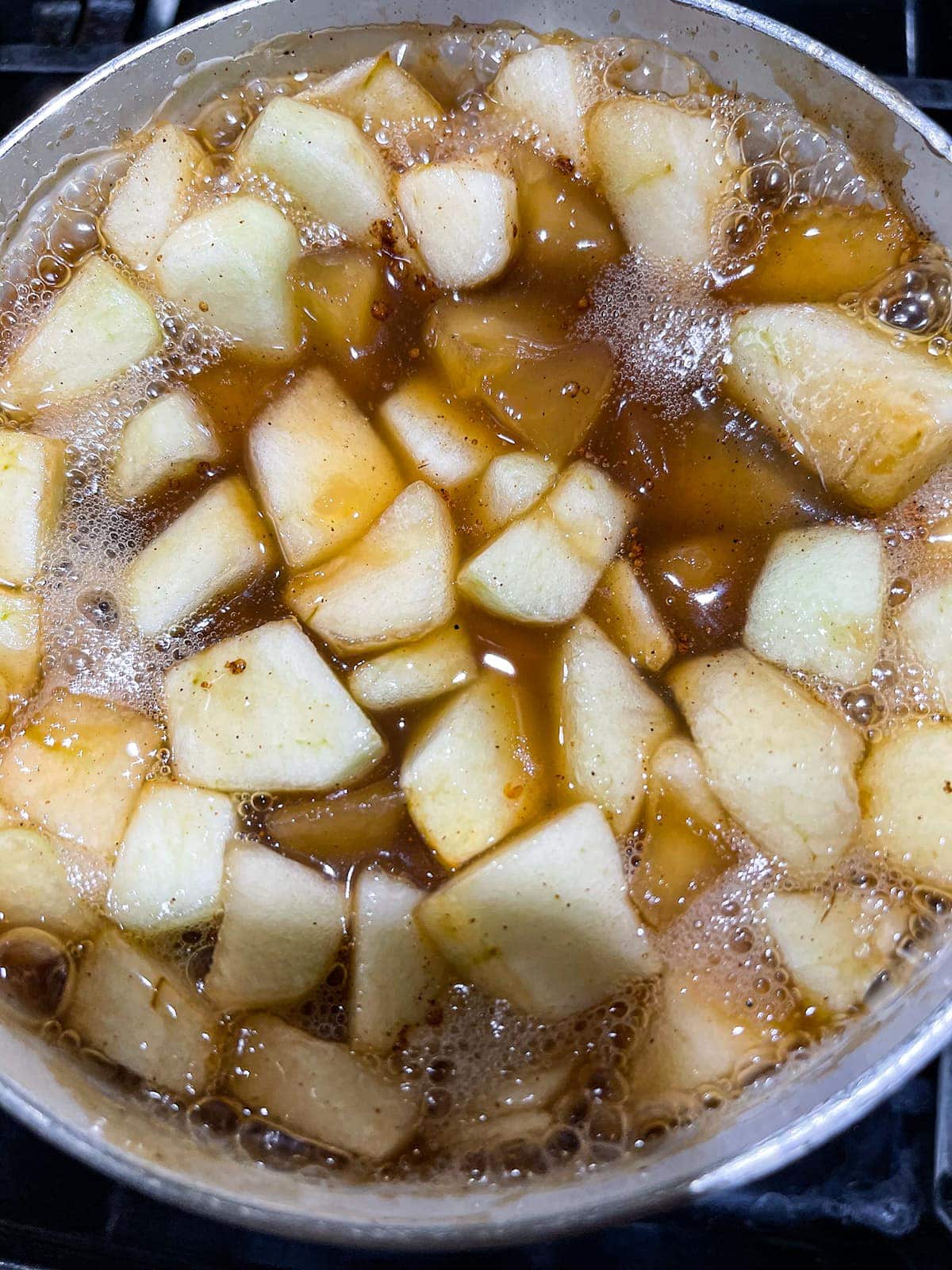 apple pie filling cooking in a pot