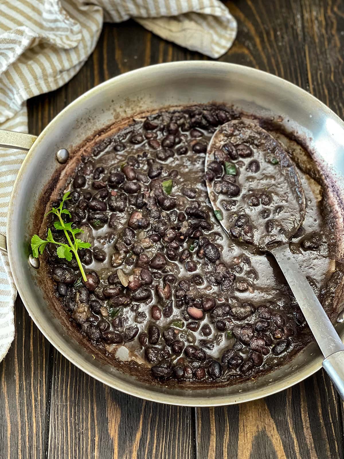 overlay of saucepan with black beans