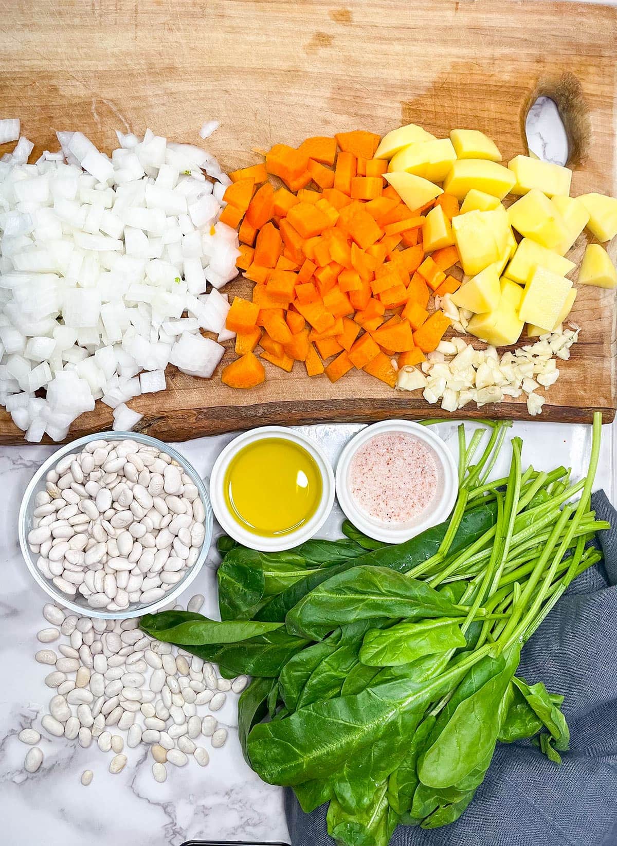 ingredients for instant pot white bean soup on a wooden background