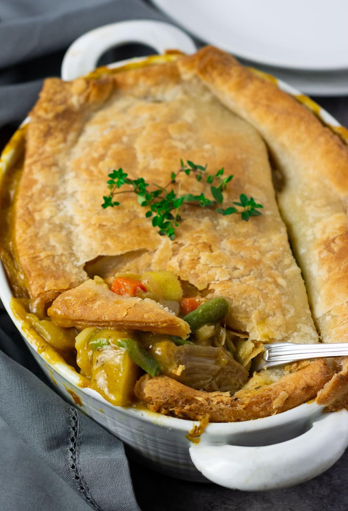 Overlay, gluten free vegan pot pie recipe with jackfruit, carrots, potato, celery in a creamy sauce