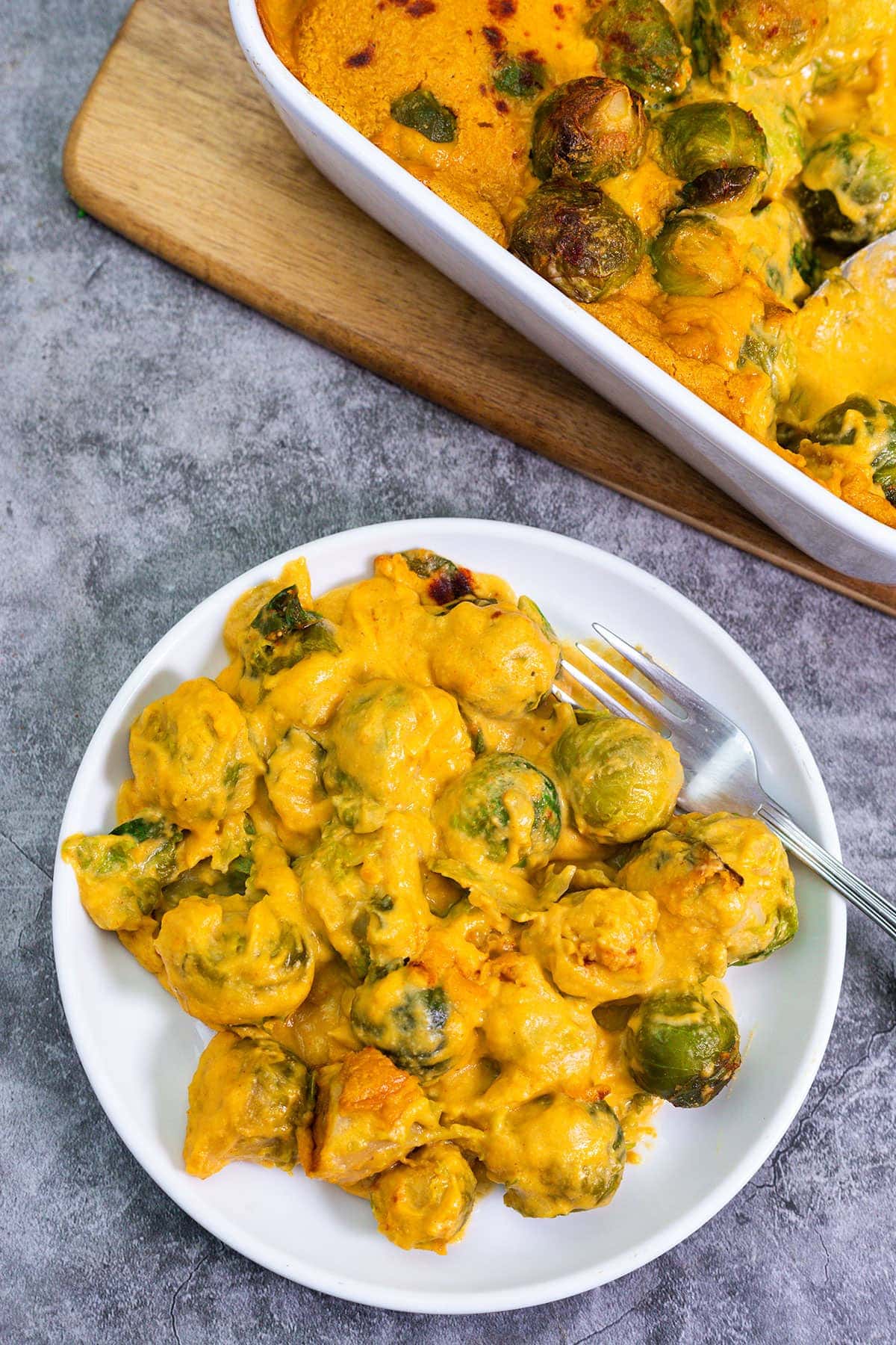 Vegan Brussels Sprouts Casserole over lay, plate with cheesy Vegan Brussels Sprouts Casserole