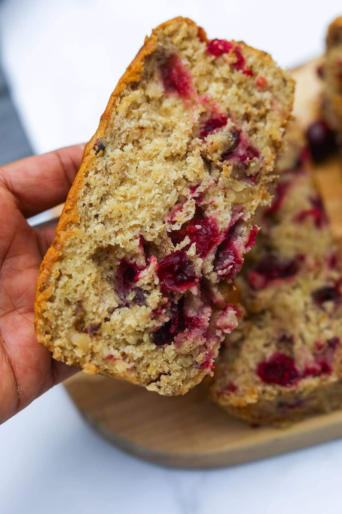 holding a slice of cranberry banana bread in my hand