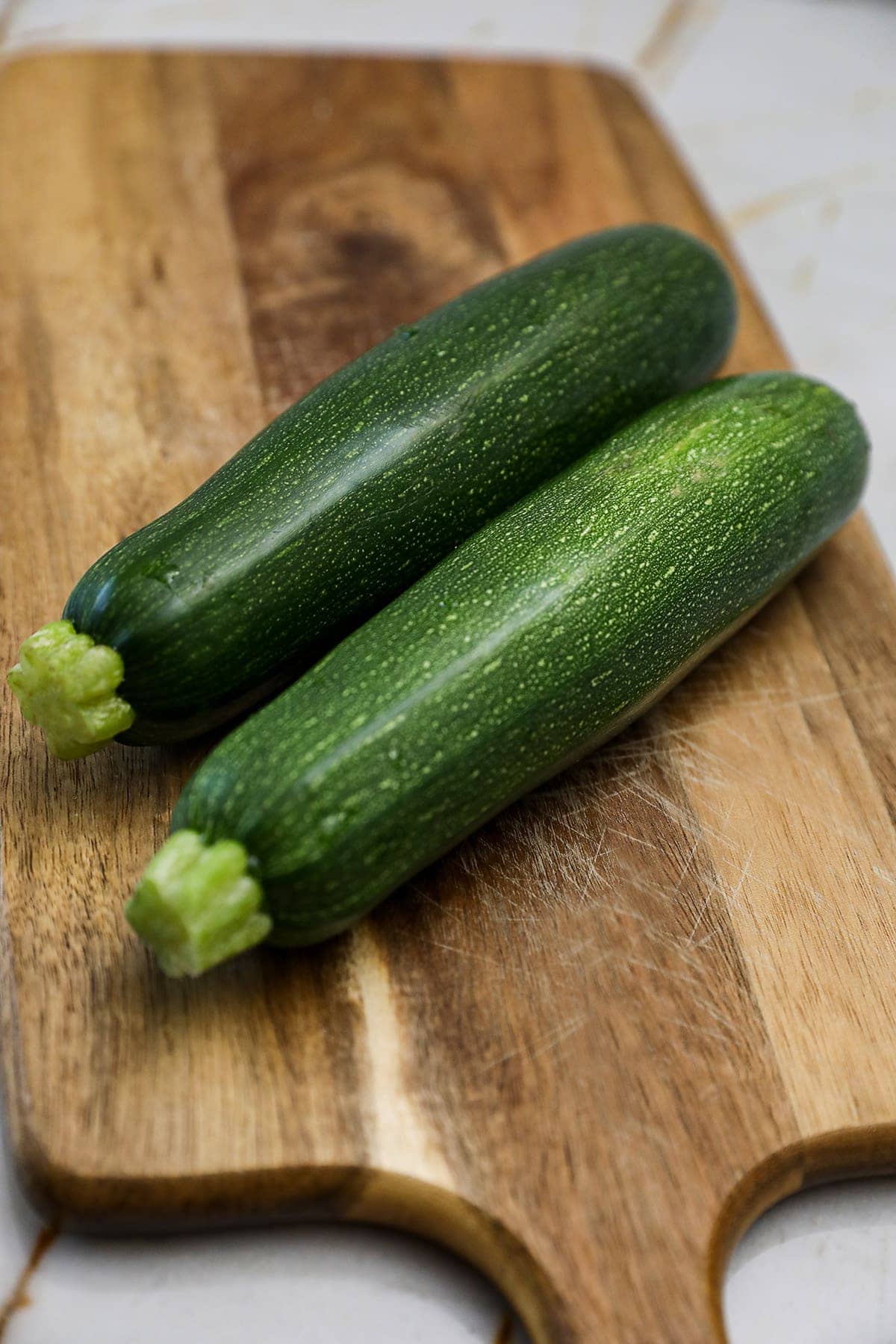 zucchini on wooden cutting board
