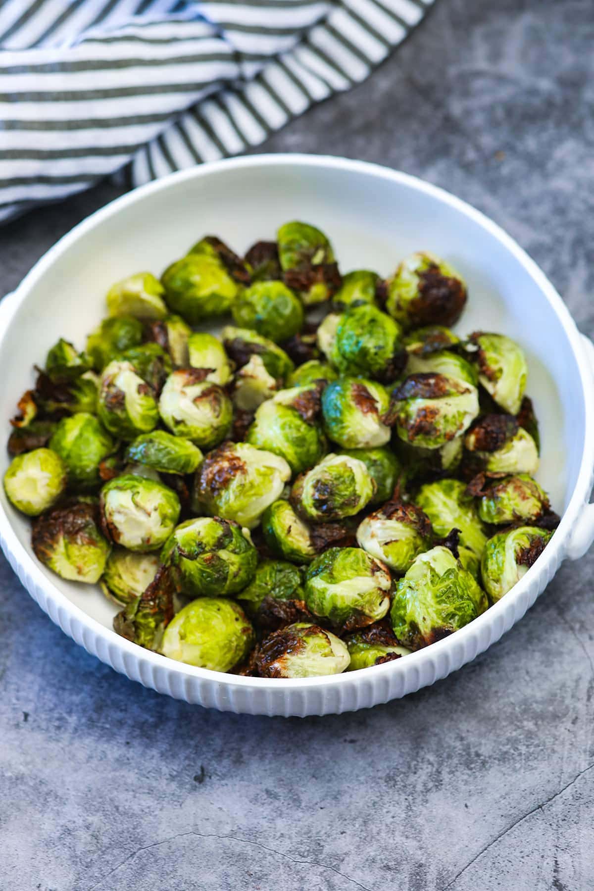 air fryer brussel sprouts in white boal of