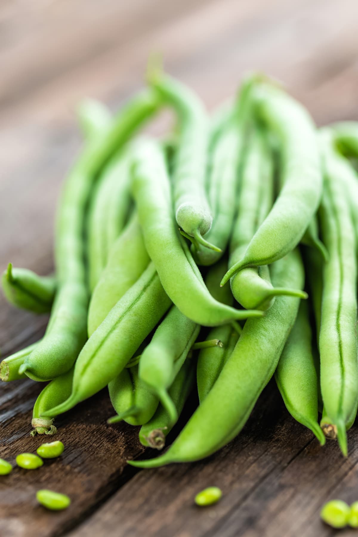 pile of green beans on wood
