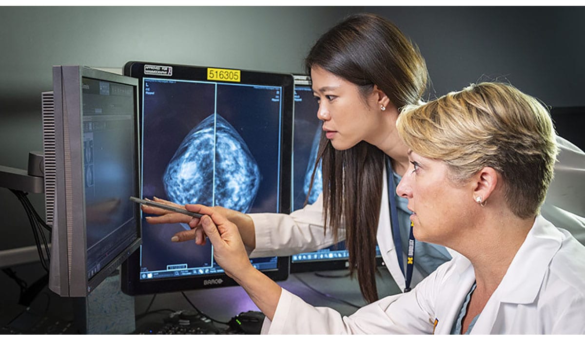 Doctors Pointing Computer Scan Mammogram Gatewayextension