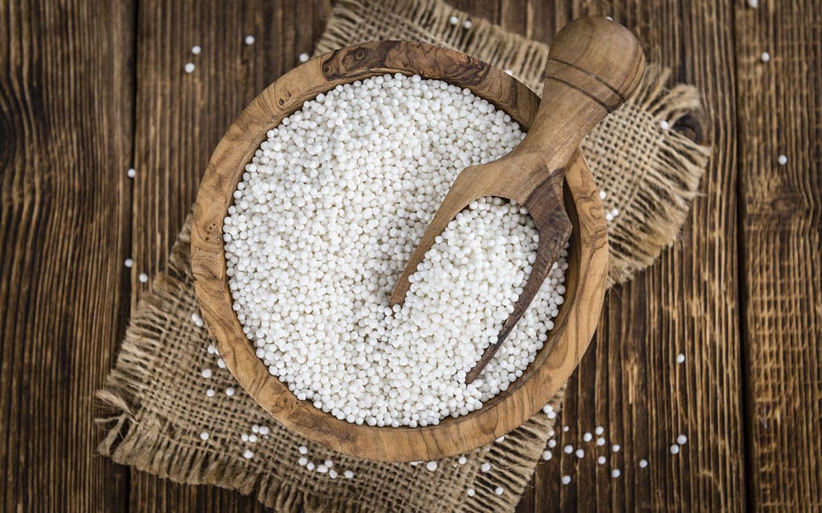 tapioca pearl in a wooden bowl on a wooden bowl on a wooden background. Arrowroot Flour Substitute