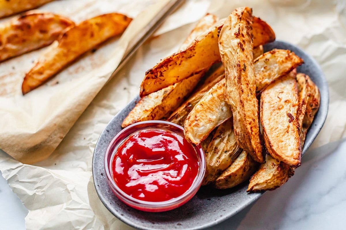 oven baked potato wedges on a grey plate