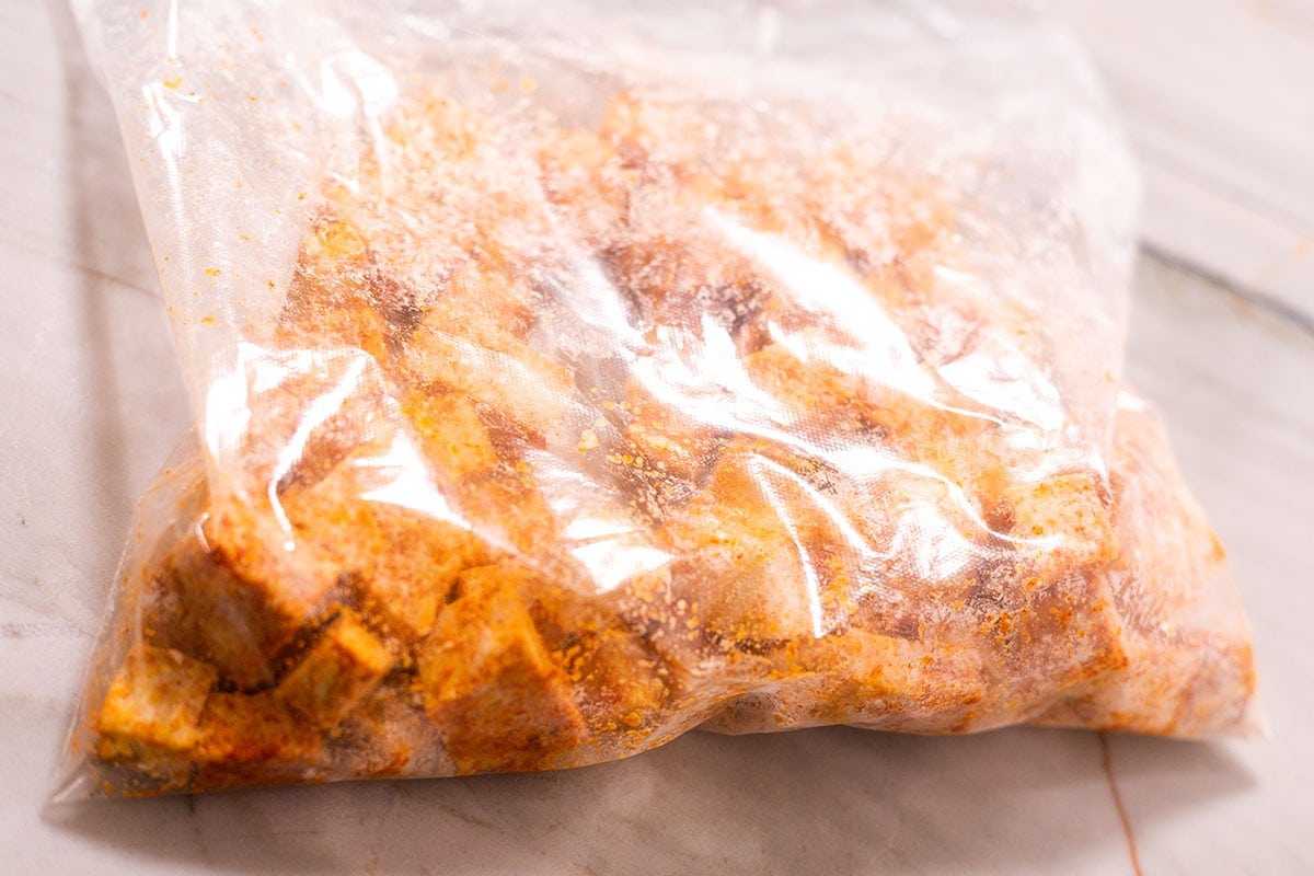 Tofu for sweet and sour tofu seasoned in a ziplock bag