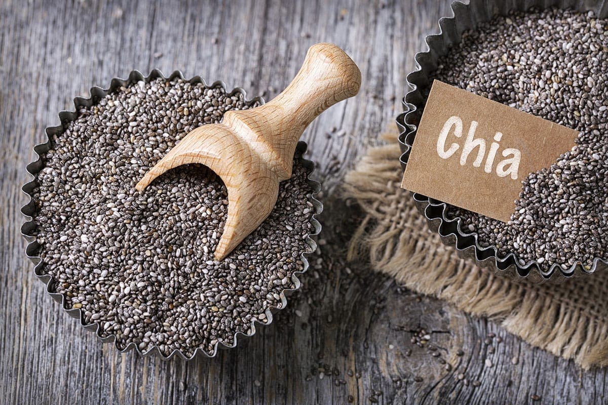 chia seeds on wooden background in tart pans