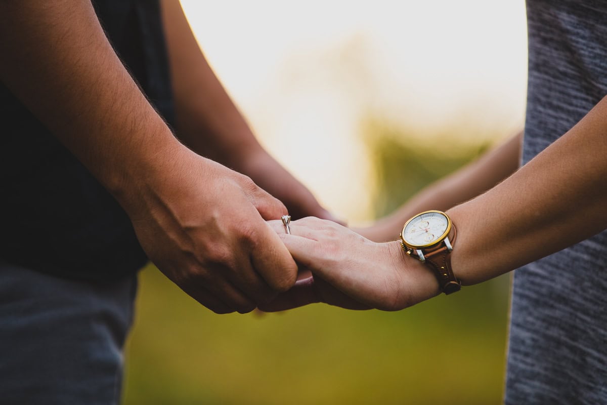 A couple holding hands.
