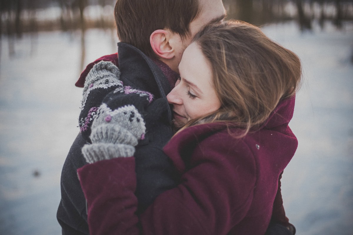 A couple embracing, a great example of physical touch.