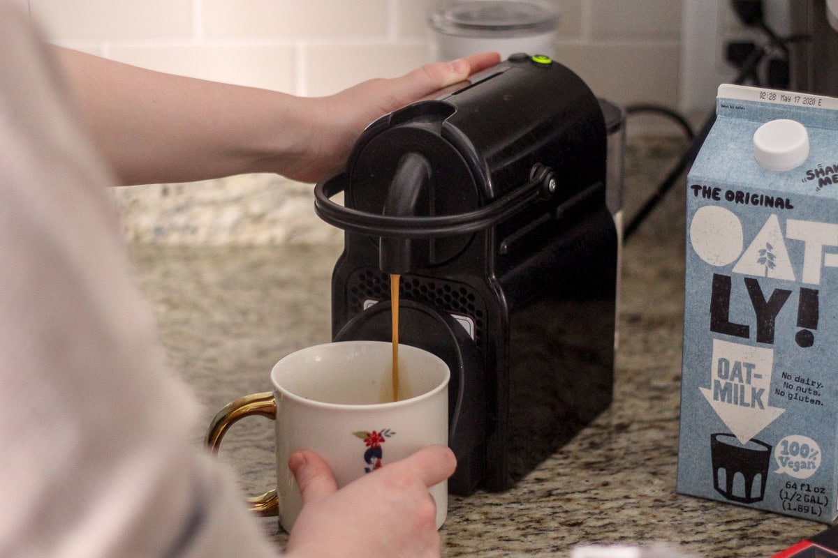 brewing the espresso from the nespresso machine for the dirty chai tea latte