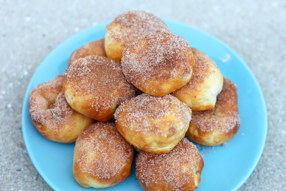 apple cider stuffed donut holes dipped in cinnamon sugar