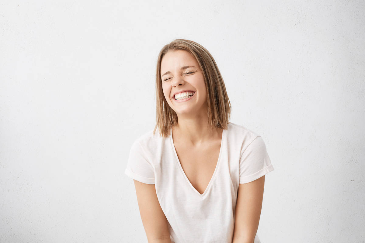 woman smiling feeling joyful