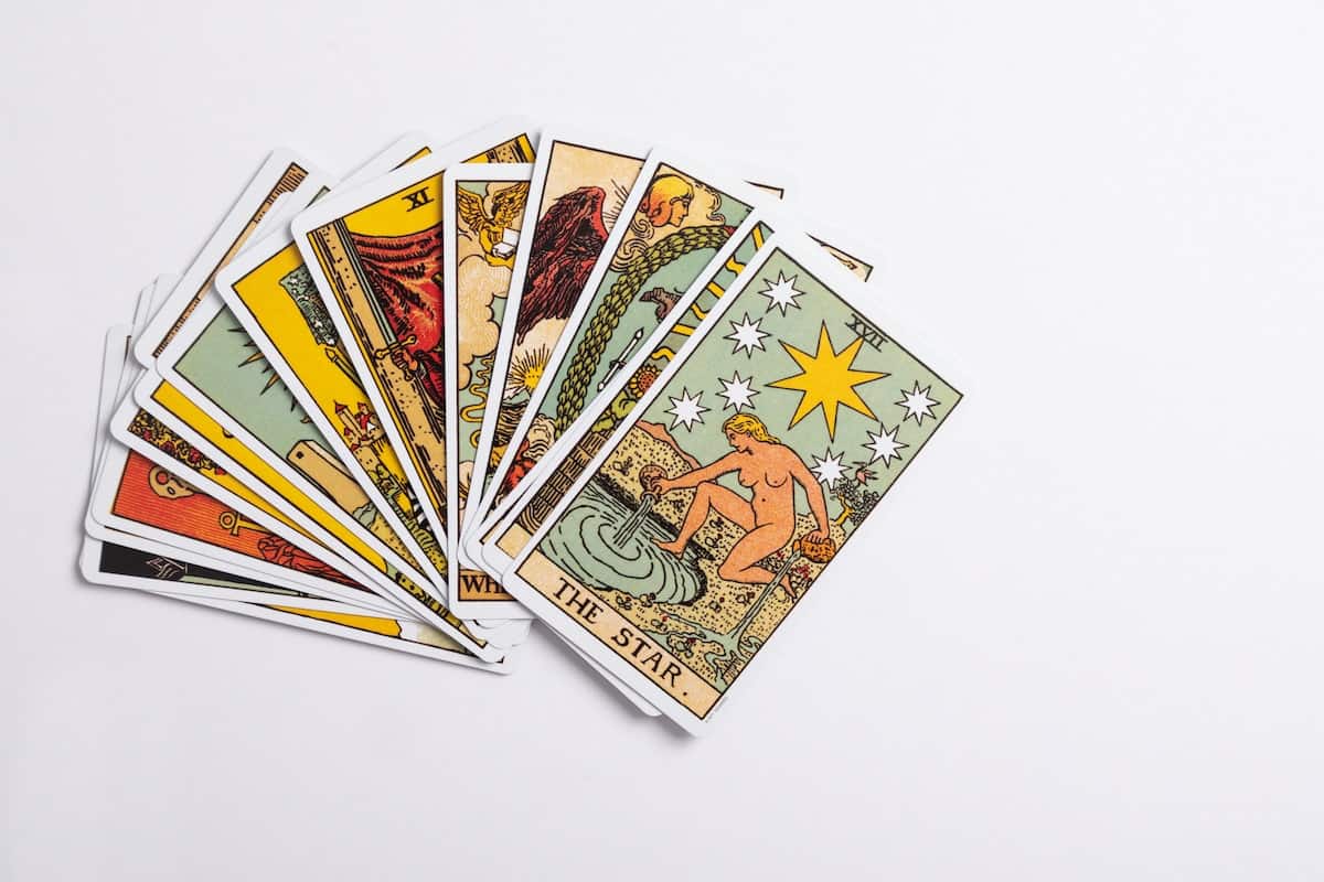 pile of tarot cards with the star tarot card on top